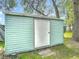 Exterior view of the backyard storage shed at 1331 Needle Palm Dr, Edgewater, FL 32132