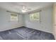 Cozy bedroom with neutral paint, ceiling fan, and carpet floors at 2416 Pine Tree Dr, Edgewater, FL 32141