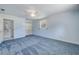 Bedroom with soft blue walls and carpet at 2416 Pine Tree Dr, Edgewater, FL 32141