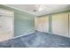 View of bedroom with neutral walls and two large closets for storage at 2416 Pine Tree Dr, Edgewater, FL 32141