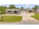 Charming single-story home with a well-manicured lawn and a cozy, inviting appeal at 2416 Pine Tree Dr, Edgewater, FL 32141