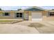 Charming one story home with a one car garage and a well maintained lawn and driveway at 2416 Pine Tree Dr, Edgewater, FL 32141