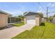 Exterior shot of a detached garage and screened in patio at 2416 Pine Tree Dr, Edgewater, FL 32141