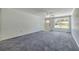 A wide view of the living room with plenty of natural light at 2416 Pine Tree Dr, Edgewater, FL 32141