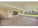 Spacious screened patio with tile flooring, direct access to the fenced yard, and great natural light at 2416 Pine Tree Dr, Edgewater, FL 32141