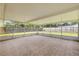 Spacious screened patio with tile flooring and views of the backyard at 2416 Pine Tree Dr, Edgewater, FL 32141