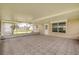 Spacious screened patio with tile flooring and views of the backyard and side yard at 2416 Pine Tree Dr, Edgewater, FL 32141