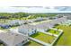 Aerial view of the home featuring a fenced-in backyard, and well-maintained lawn at 2667 Neverland Dr, New Smyrna Beach, FL 32168