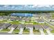Aerial view of house in neighborhood with pond at 2667 Neverland Dr, New Smyrna Beach, FL 32168