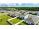 Aerial view of the home featuring a fenced-in backyard, and well-maintained lawn at 2667 Neverland Dr, New Smyrna Beach, FL 32168