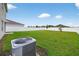 Backyard featuring a well maintained lawn and white privacy fence at 2667 Neverland Dr, New Smyrna Beach, FL 32168