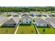 Aerial view of backyard featuring a large, well-maintained lawn and a white fence at 2667 Neverland Dr, New Smyrna Beach, FL 32168