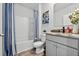 Bathroom with modern fixtures, decorative mirror and a tub and shower combo at 2667 Neverland Dr, New Smyrna Beach, FL 32168
