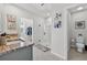 Clean and modern bathroom with double sinks, granite countertops, glass shower, and walk-in closet at 2667 Neverland Dr, New Smyrna Beach, FL 32168