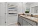 Bathroom featuring double vanity, modern fixtures, and decorative art at 2667 Neverland Dr, New Smyrna Beach, FL 32168