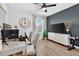 Bedroom with dark accent wall, wood floors, and modern décor at 2667 Neverland Dr, New Smyrna Beach, FL 32168