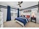 Bedroom featuring a fan, window and decorative wall trim and decor at 2667 Neverland Dr, New Smyrna Beach, FL 32168