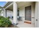 View of the front porch with seating and well-maintained landscaping at 2667 Neverland Dr, New Smyrna Beach, FL 32168