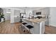 Modern kitchen with granite countertops, stainless steel appliances, island and breakfast bar at 2667 Neverland Dr, New Smyrna Beach, FL 32168