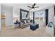 Comfortable living room with neutral carpet, blue accent wall, and comfortable seating at 2667 Neverland Dr, New Smyrna Beach, FL 32168