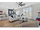Open-concept living room featuring a large sectional sofa, modern decor and backyard view at 2667 Neverland Dr, New Smyrna Beach, FL 32168