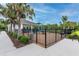 A fenced playground area is near a covered seating area at 2667 Neverland Dr, New Smyrna Beach, FL 32168