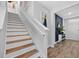 Staircase featuring wood and white trim leading to second level of home at 2667 Neverland Dr, New Smyrna Beach, FL 32168