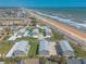 Aerial view shows the neighborhood and beach access at 2898 Ocean Shore Blvd # 5020, Ormond Beach, FL 32176