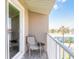 Intimate balcony with seating, offering a private outdoor retreat with serene neighborhood vistas at 2898 Ocean Shore Blvd # 5020, Ormond Beach, FL 32176