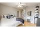 Cozy bedroom with decorative lighting, a full-length mirror, and organized shoe shelves at 2898 Ocean Shore Blvd # 5020, Ormond Beach, FL 32176
