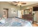 This is a spacious bedroom with a ceiling fan, ensuite bathroom and plenty of storage at 2898 Ocean Shore Blvd # 5020, Ormond Beach, FL 32176