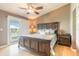 Comfortable main bedroom featuring a ceiling fan and sliding doors to a balcony at 2898 Ocean Shore Blvd # 5020, Ormond Beach, FL 32176