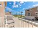 Exterior view from the balcony of a neighborhood with palm trees and the ocean at 2898 Ocean Shore Blvd # 5020, Ormond Beach, FL 32176