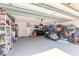Organized garage featuring a motorcycle and various storage solutions for all your needs at 2898 Ocean Shore Blvd # 5020, Ormond Beach, FL 32176