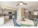 Bright kitchen with stainless steel appliances, granite counters, and tile floors, perfect for cooking and entertaining at 2898 Ocean Shore Blvd # 5020, Ormond Beach, FL 32176