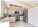 Charming kitchen featuring stainless steel appliances, granite countertops, and ample cabinet space at 2898 Ocean Shore Blvd # 5020, Ormond Beach, FL 32176