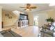 Comfortable living room features hardwood floors, TV, and natural light, perfect for relaxation and entertainment at 2898 Ocean Shore Blvd # 5020, Ormond Beach, FL 32176