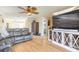 Cozy living room features hardwood floors, neutral paint, ceiling fan and comfortable seating, creating a warm and inviting atmosphere at 2898 Ocean Shore Blvd # 5020, Ormond Beach, FL 32176