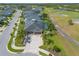 Inviting home with a three car garage, a screened pool, and a brick paved driveway enhanced by landscaping, on a golf course at 2939 Bella Flore Ter, New Smyrna Beach, FL 32168