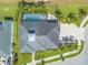 Aerial shot of property with a large pool, outdoor patio, and landscaped yard at 2939 Bella Flore Ter, New Smyrna Beach, FL 32168