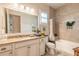 Bathroom with granite countertop, large mirror, bathtub, and tile throughout at 2939 Bella Flore Ter, New Smyrna Beach, FL 32168