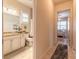 Bathroom with ample storage, large mirror, and access to the Primary bedroom at 2939 Bella Flore Ter, New Smyrna Beach, FL 32168