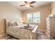 Comfortable bedroom featuring a ceiling fan, lots of natural light, and beautiful interior decorations at 2939 Bella Flore Ter, New Smyrna Beach, FL 32168