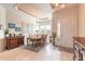 Elegant dining room with tray ceiling, chandelier, and stylish furnishings, creating a welcoming atmosphere at 2939 Bella Flore Ter, New Smyrna Beach, FL 32168