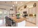 Bright, open kitchen featuring a large center island with seating, white cabinets, and modern appliances at 2939 Bella Flore Ter, New Smyrna Beach, FL 32168