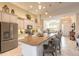 Bright, open kitchen with granite island, stainless steel appliances, and pendant lighting at 2939 Bella Flore Ter, New Smyrna Beach, FL 32168