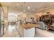 Spacious open-concept living area with tile flooring, kitchen island, and dining area views at 2939 Bella Flore Ter, New Smyrna Beach, FL 32168