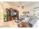 Cozy living room featuring a large entertainment center, comfortable seating, and a ceiling fan at 2939 Bella Flore Ter, New Smyrna Beach, FL 32168