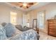 Relaxing main bedroom with a view to the outdoor patio, a walk-in closet, and an en-suite bathroom at 2939 Bella Flore Ter, New Smyrna Beach, FL 32168