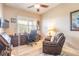 Home office with wooden furniture, large window, and comfortable recliner for relaxing at 2939 Bella Flore Ter, New Smyrna Beach, FL 32168